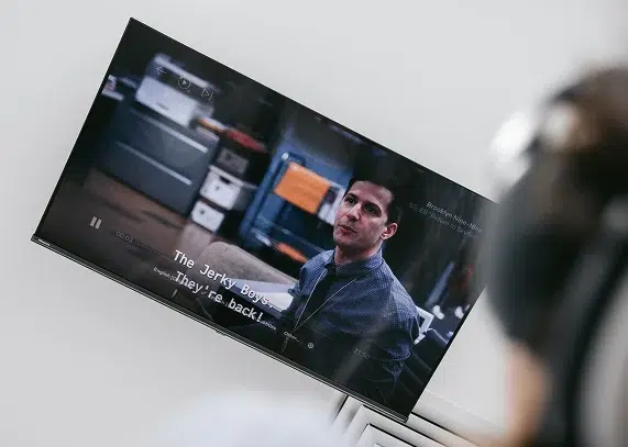Ceiling-mounted TVs and noise-cancelling headphones at Smile Lounge